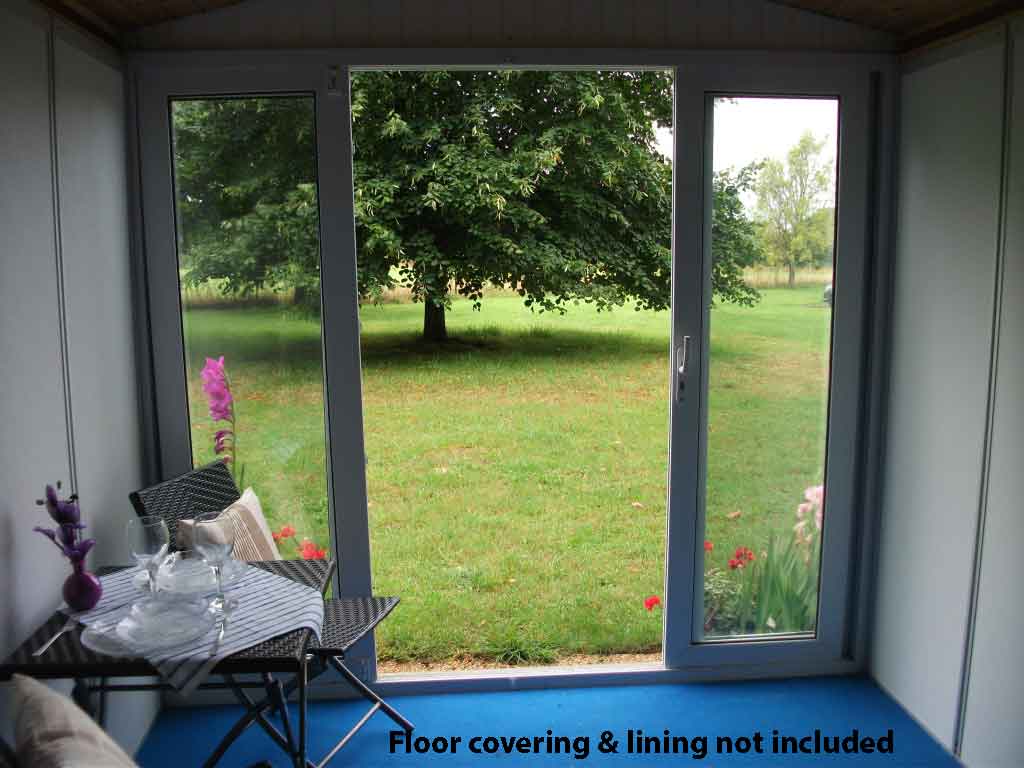 Inside the Cheltenham Garden Room - showing chairs and table on top of a blue floor covering  - covering is not included